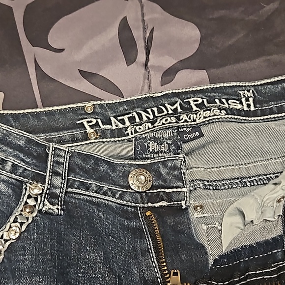 A pair of boot-cut  Platinum Plush jeans - Picture 3 of 11